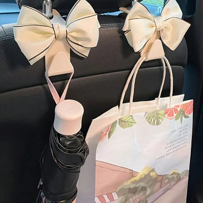 2pcs Elegant Bow-Knot Car Seat Headrest Hooks- White Multifunctional Headrest Hanger, For Vehicle Storage And Organization, Fashionable Car Interior Accessories, Car Seat Accessories
