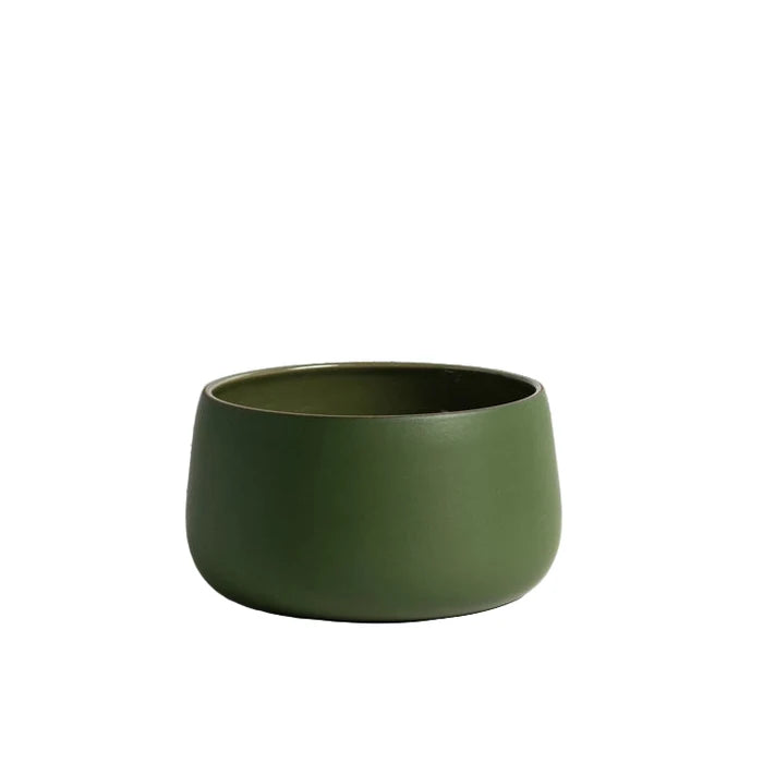 green serving bowl on white background