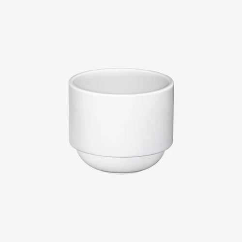 Hasami Porcelain rounded bottom tea cup in white, showcasing modern design and multifunctional features.