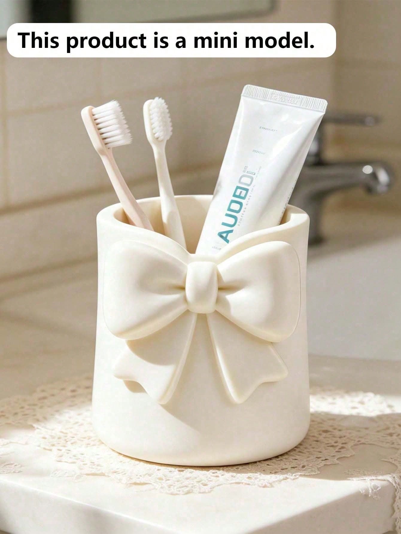 Mini Cream-Colored Bow-Shaped Creative Toothbrush Holder, Can Be Used As A Toothbrush Cup Or Desktop Storage Organizer. It Can Hold Toothbrushes, Toothpaste And Other Items. At The Same Time, It Can A