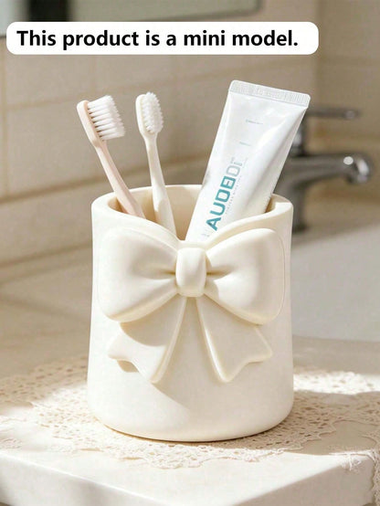 Mini Cream-Colored Bow-Shaped Creative Toothbrush Holder, Can Be Used As A Toothbrush Cup Or Desktop Storage Organizer. It Can Hold Toothbrushes, Toothpaste And Other Items. At The Same Time, It Can A