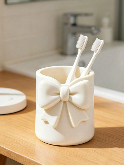 Mini Cream-Colored Bow-Shaped Creative Toothbrush Holder, Can Be Used As A Toothbrush Cup Or Desktop Storage Organizer. It Can Hold Toothbrushes, Toothpaste And Other Items. At The Same Time, It Can A