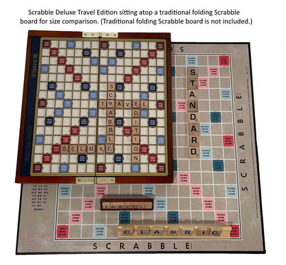 Scrabble Deluxe Travel Edition game board on top of a traditional folding Scrabble board for size comparison.