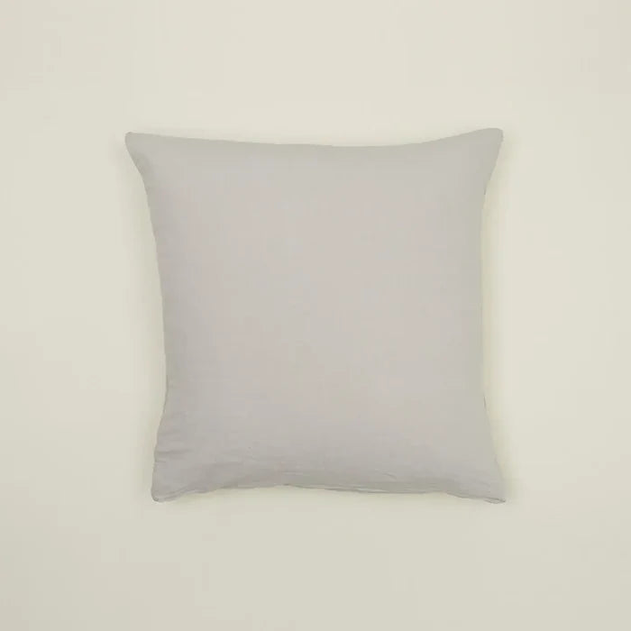 Simple light gray linen pillow, made from Belgian linen, adding casual luxury to any cozy space.