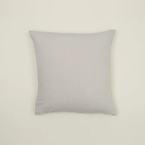 Simple light gray linen pillow, made from Belgian linen, adding casual luxury to any cozy space.