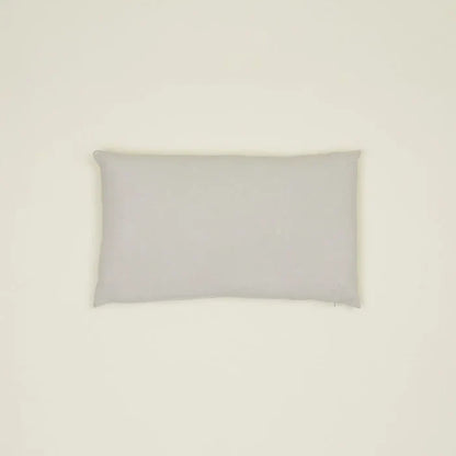 Simple light gray linen pillow, made from high-quality Belgian linen, featuring a cozy feel and oversized down insert.